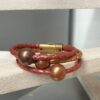 Bracelet femme en cuir rond tressé et ses trois perles cuivres