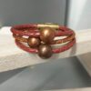 Bracelet femme en cuir rond tressé et ses trois perles cuivres