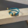 Bague femme en cuir 2mm turquoise et perles bronzes