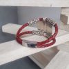 Bracelet cuir tressé rouge et passants argentés