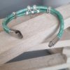 Bracelet cuir rond vert perles et pendentif ovale argentés