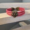 Bracelet enfant cuir rond rose et orange et fleur bronze