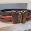 Bracelet femme en cuir et son fermoir papillon