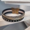 Bracelet femme en suédine noir et cuir doré, fermoir papillon