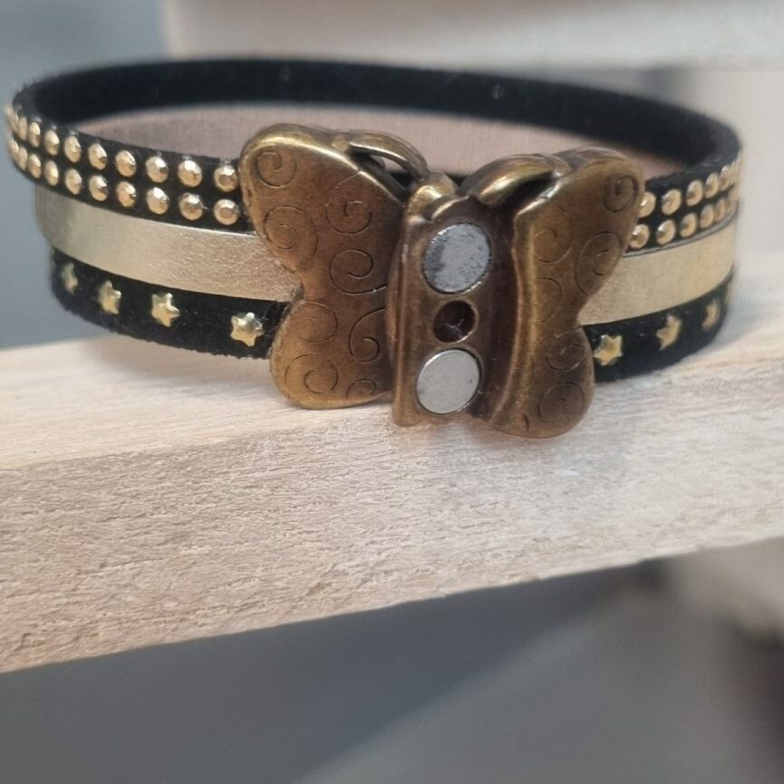 Bracelet femme en suédine noir et cuir doré, fermoir papillon