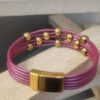 Bracelet femme cuir rond rose et ses perles dorées