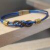 Bracelet femme cuir rond bleu et sigle infini bronze