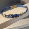 Bracelet femme cuir rond bleu et sigle infini bronze