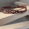 Bracelet mixte en cuir rond et son sigle infini noir