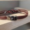 Bracelet mixte en cuir rond et son sigle infini noir