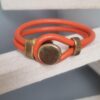 Bracelet mixte en cuir rond orange et fermoir bouton