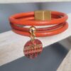 Bracelet femme en cuir rond orange et médaillon orange et étoile dorée