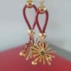 Boucles d'oreille en cuir rouge rond et son étincelle dorée