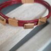 Bracelet femme en cuir rond rouge et passants roses dorés