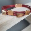 Bracelet femme en cuir rond rouge et passants roses dorés