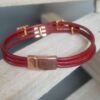 Bracelet femme en cuir rond rouge et passants roses dorés