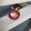 Bague femme en cuir rond rouge 2mm et passant ovale doré