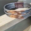 Bracelet en cuir rond argenté et tubes or rosé