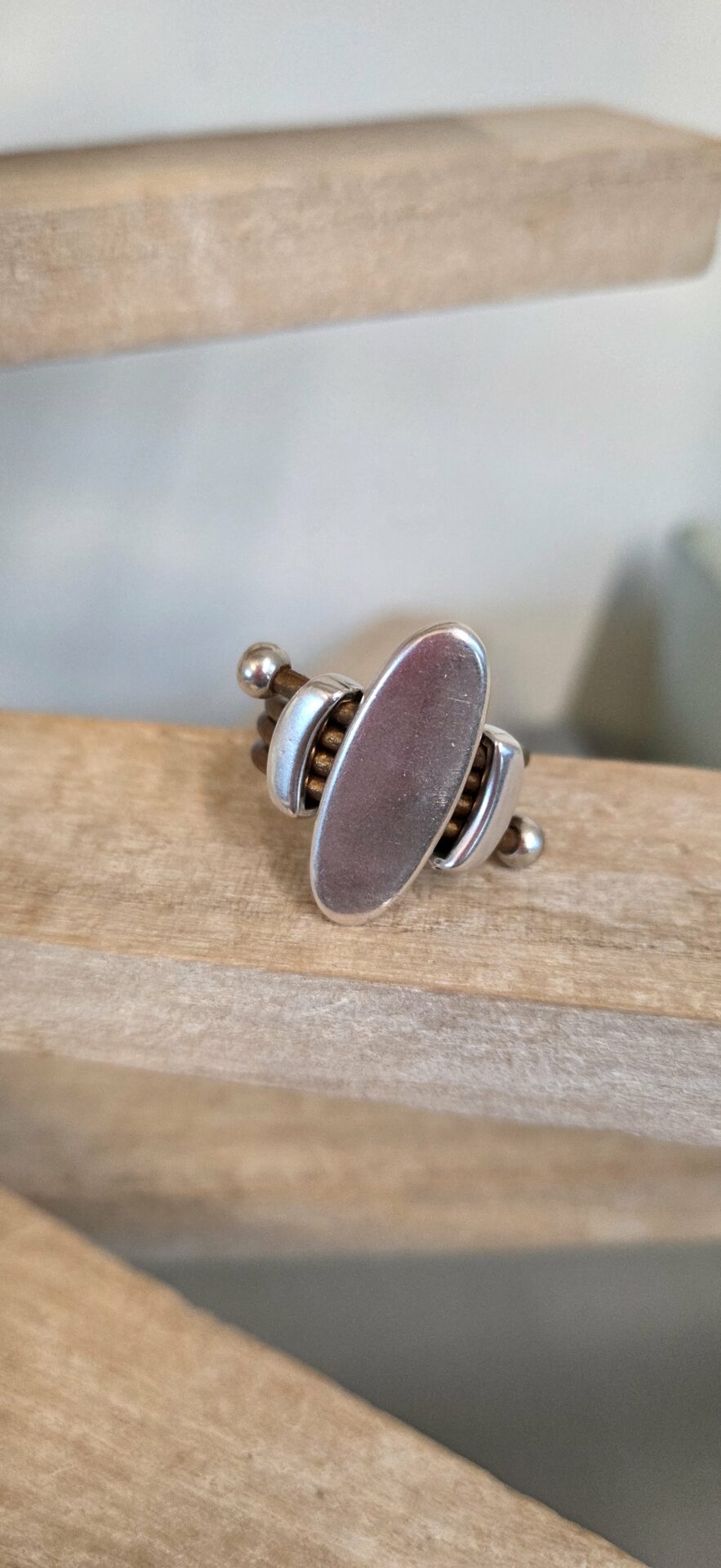 Bague femme cuir rond bronze et passants argentés