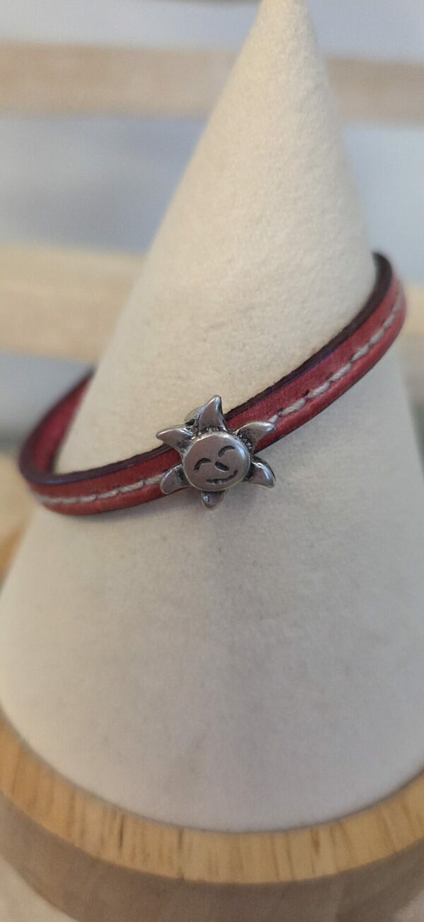 Bracelet enfant en cuir rose et soleil argenté