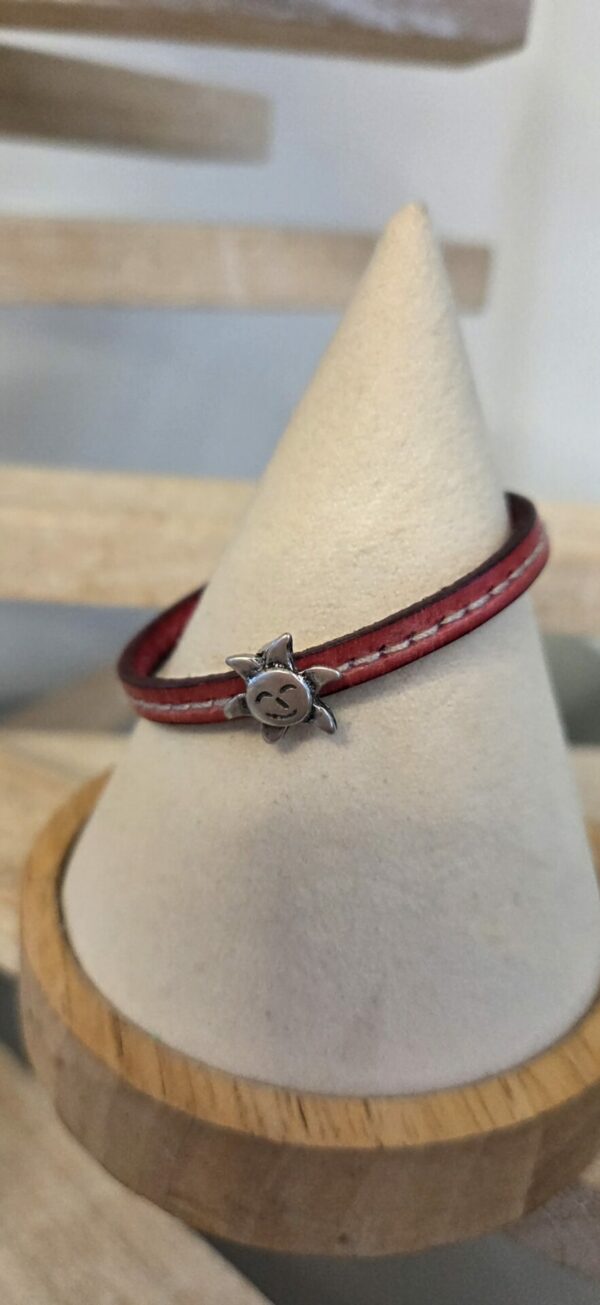 Bracelet enfant en cuir rose et soleil argenté