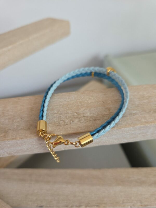 Bracelet femme cuir plat tressé bleu et ses yeux émaillés